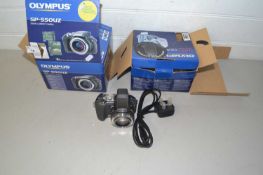 Olympus SP-550UZ digital camera together with various accessories