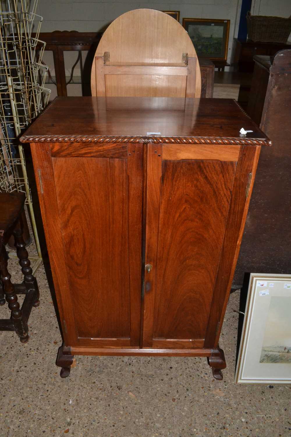 Early 20th Century two door cupboard on short cabriole legs