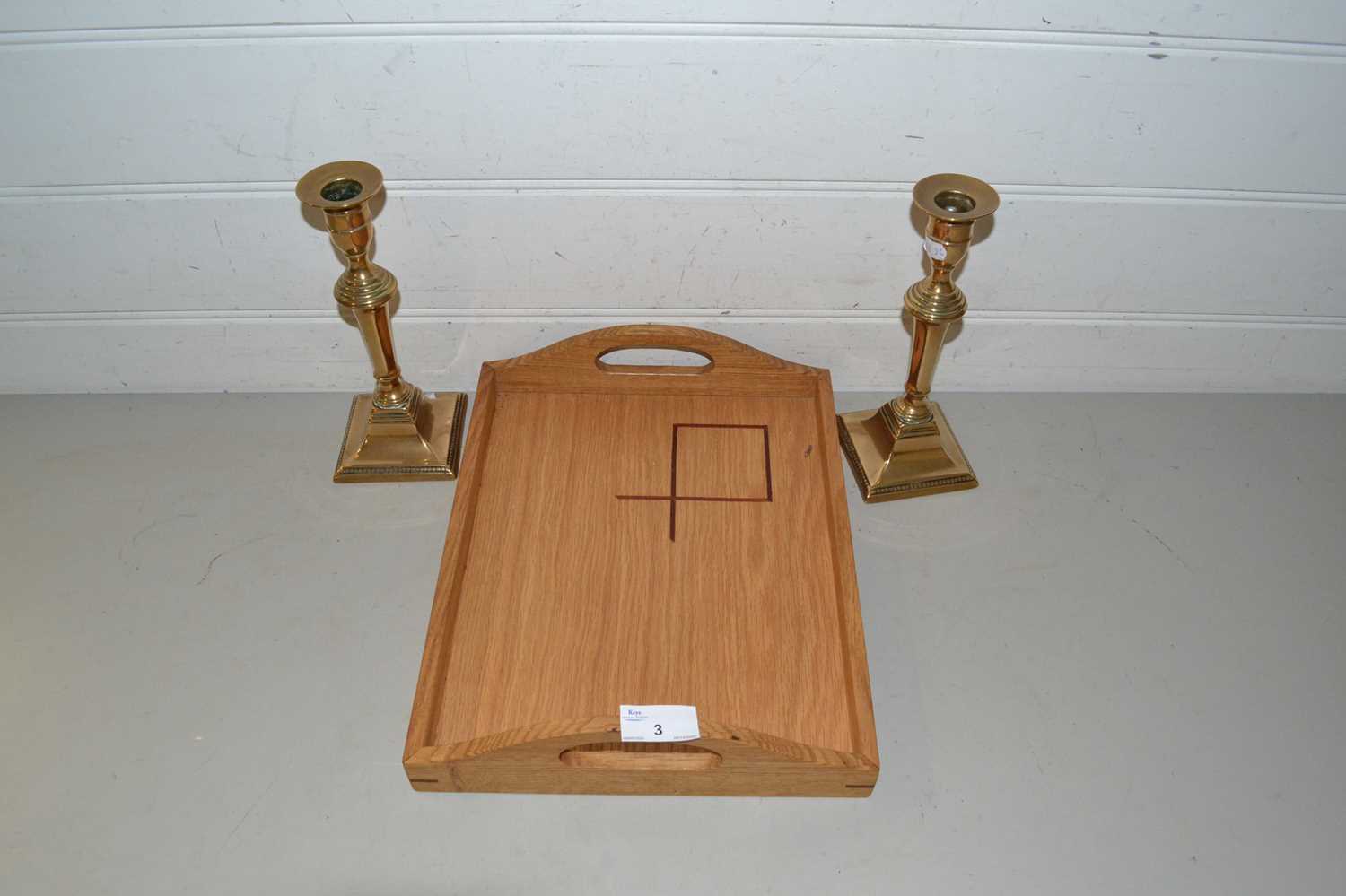 Pair of brass candlesticks and a serving tray