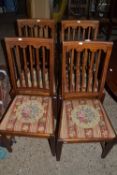 Set of four Edwardian mahogany dining chairs with tapestry seats
