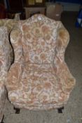 Early 20th Century wing back armchair on ball and claw feet