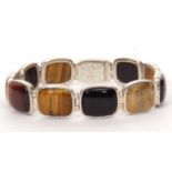 Modern 925 panelled bracelet comprising ten oval links, onyx, agate and tigers eye insets, stamped