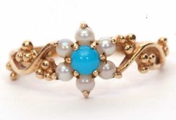 9ct gold turquoise and seed pearl cluster ring, the flower head raised between ornate pierced and