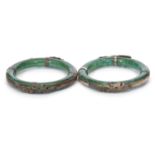 Mixed Lot: Two Chinese green glass bangles applied with metal dragon design