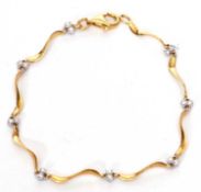 18ct gold and diamond bracelet, the S bar shaped links joined by small diamond set connectors,