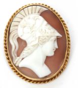 An antique cameo carved shell brooch depicting a Centurion in a rope twist frame, stamped 9ct, 50
