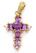 Modern amethyst and seed pearl cross pendant, the centre with oval faceted amethyst, the arms having