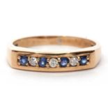 9ct gold sapphire and diamond ring, alternate chanel set with four round cut sapphires and three