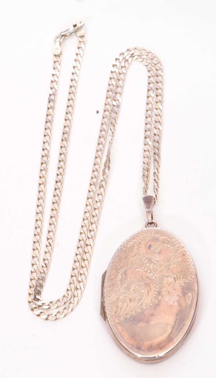 White metal oval locket, part chased and engraved with scrolls suspended from a 925 stamped chain - Image 3 of 6