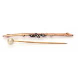 9ct stamped seed pearl set brooch, 75mm long together with a pearl finial set stick pin