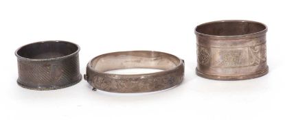 Mixed Lot: Silver hinged bracelet, the top section chased and engraved with a foliate design,