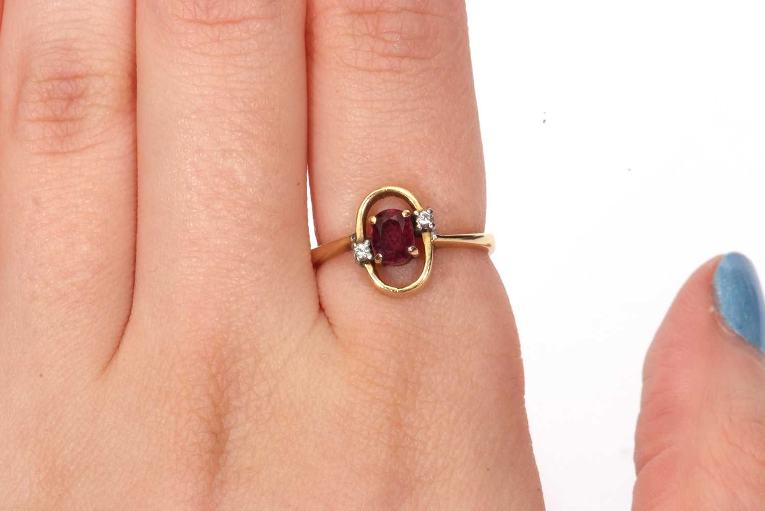 Modern ruby and diamond ring, the oval faceted ruby in an oval halo surround highlighted with two - Image 9 of 9