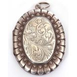 Hallmarked silver large oval locket, the centre chased and engraved with scrolls, 50 x 40 mm,