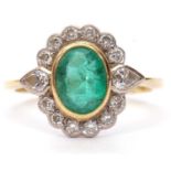 18ct gold emerald and diamond cluster ring, the bezel set oval emerald set within a pear and round