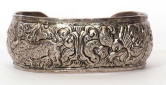 Metal torque bangle decorated with dragons and scrolls etc