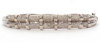 Modern 9ct white gold and diamond hinge bracelet, the top section with a rope design set with