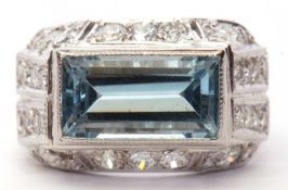 Art Deco oblong light blue stone ring in cut down setting and raised above a diamond mount set