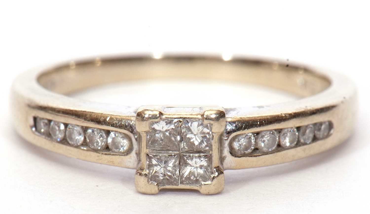 A modern diamond set ring, the square panel set with four small princess cut diamonds and raised - Image 2 of 9