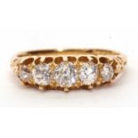 18ct gold five stone diamond ring featuring five graduated round old brilliant cut diamonds, total