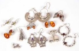 Mixed lot of eleven pairs of white metal earrings to include three amber examples, g/w 70.3gms
