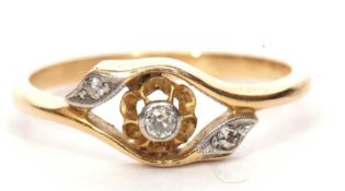 Antique three stone diamond ring in cross over style set with three small graduated diamonds,
