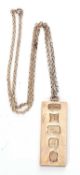 Silver ingot pendant with oversized jubilee hallmarks, Birmingham 1977, suspended from a sterling
