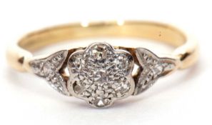 Small diamond cluster ring, the central diamond flower head raised between leaf shaped diamond set