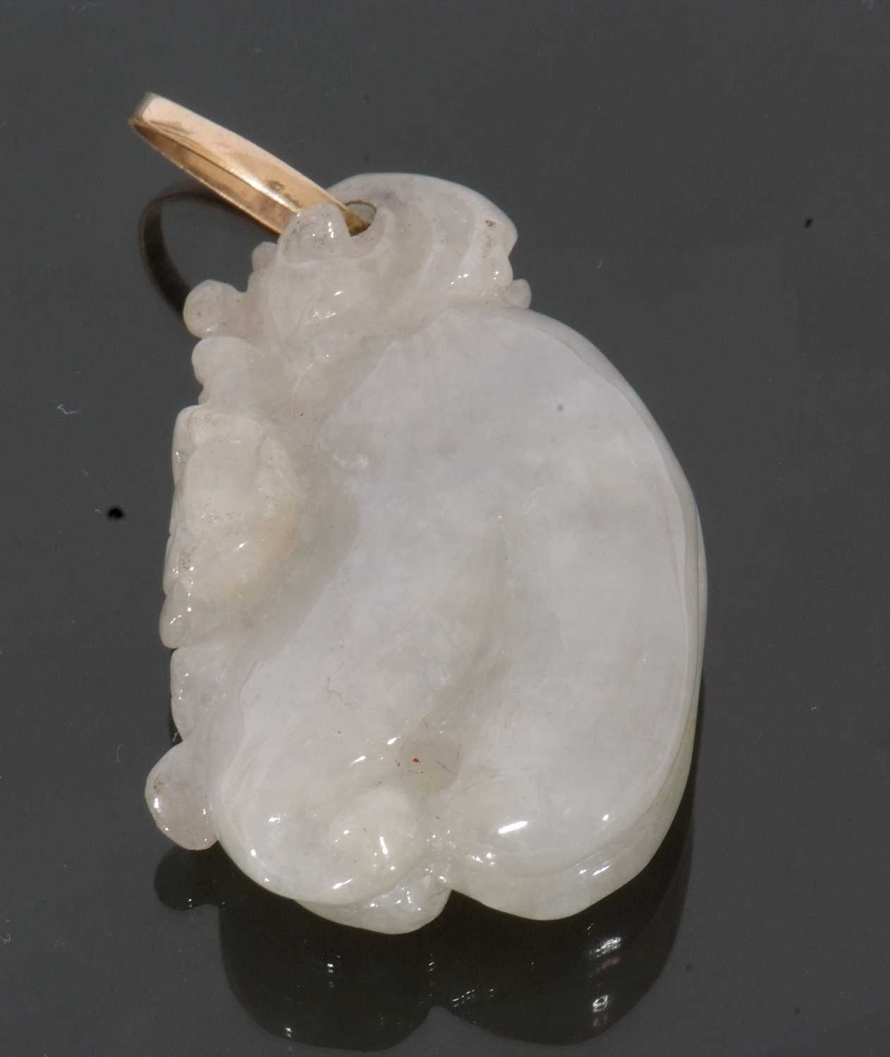 Modern pale carved jade pendant, figure of a seated animal, 35 x 20cm
