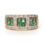 Modern 9ct gold emerald and diamond cluster ring, a design with three square panels made up of