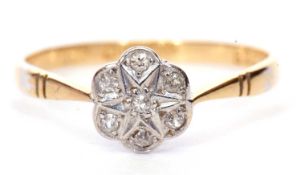 18ct gold diamond cluster ring, a flower head design set with seven small round cut diamonds,