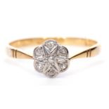 18ct gold diamond cluster ring, a flower head design set with seven small round cut diamonds,