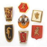 Group of seven Art Deco style brooches, gilt metal and decorated with lizards, seahorses, griffins