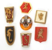 Group of seven Art Deco style brooches, gilt metal and decorated with lizards, seahorses, griffins