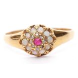 Late Victorian opal, ruby and diamond cluster ring centering a round cut ruby raised above a small