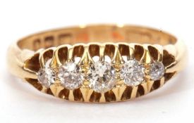 Antique 18ct gold firestone diamond ring featuring five graduated round old brilliant cut