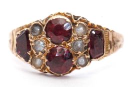 Antique 9ct gold garnet and pearl ring featuring two round and two oblong cut garnets highlighted