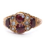 Antique 9ct gold garnet and pearl ring featuring two round and two oblong cut garnets highlighted