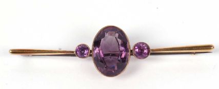 Vintage amethyst brooch, the large faceted oval shaped amethyst is 18x12mm, flanked by two small