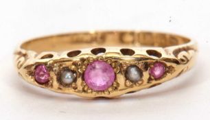 Antique 18ct gold ruby and pearl five stone ring of boat shape and featuring three round cut