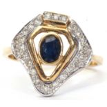 Modern sapphire and diamond designer ring, centering a dark oval faceted sapphire in an open work