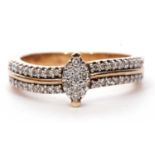 Modern 9ct gold and diamond cluster ring centering a marquise shaped diamond cluster raised above