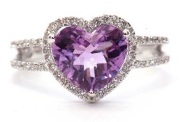 Modern 19ct white gold amethyst and diamond ring, the heart shaped faceted amethyst set within a