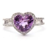 Modern 19ct white gold amethyst and diamond ring, the heart shaped faceted amethyst set within a