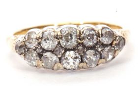 Diamond cluster ring, a design featuring two rows of old cut diamonds highlighted between with