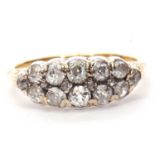 Diamond cluster ring, a design featuring two rows of old cut diamonds highlighted between with