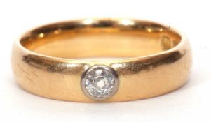 Early 20th Century 18ct gold and diamond ring, the plain polished band bezel set with an old cut