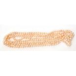 Single row of opera length fresh water cultured pearls of irregular shape, 125cm long