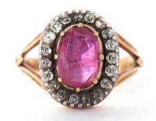 Antique ruby and diamond cluster ring, the oval shape faceted ruby is 10 x 7 mm approx, multi claw