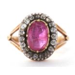 Antique ruby and diamond cluster ring, the oval shape faceted ruby is 10 x 7 mm approx, multi claw