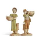 Two Worcester figures of children holding a basket decorated in shot enamels (2) 24cm tall
